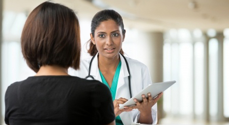 A health professional consulting a client